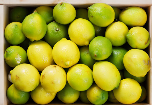 Wooden box full of lemon Beautiful fruit texture. Background texture food.