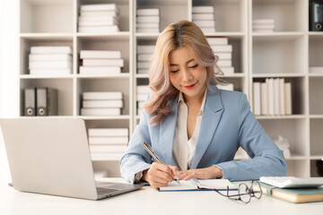 Company employee checking financial data or marketing report working in office with laptop An accountant consults on some documents.