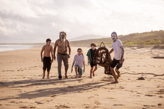 Aboriginal mob at the beach looking at camera