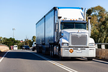 Semi trailer truck transporting goods on highway in Australia