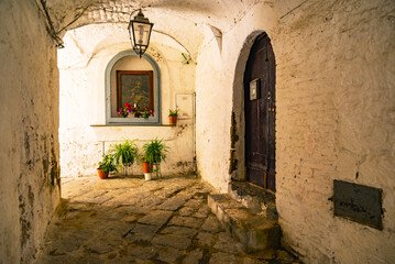 Fototapeta na wymiar Sessa Aurunca, Italy. A small street among the old houses of a medieval village in the province of Caserta