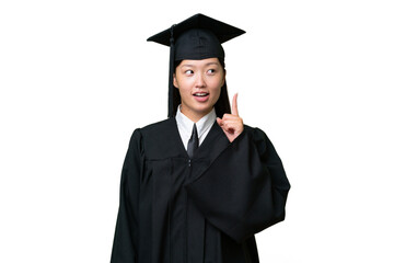 Young university graduate Asian woman over isolated background thinking an idea pointing the finger up