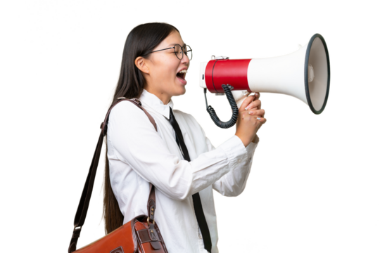 Young Asian business woman over isolated background shouting through a megaphone