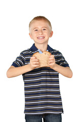 Young boy holding wheat bread with bite out of it