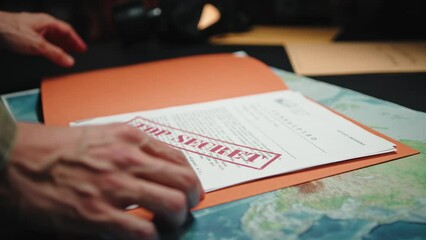 Soldier Consults Top Secret Documents - Powered by Adobe