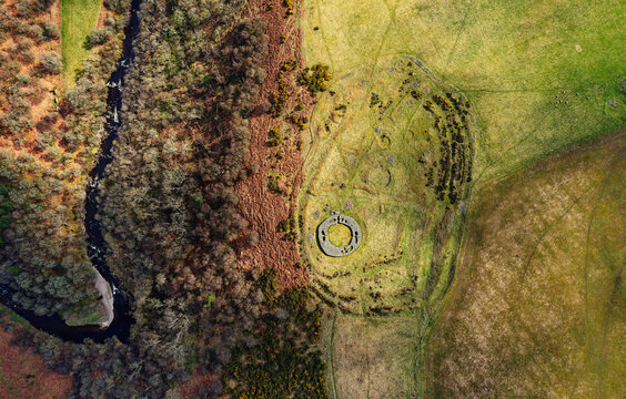 Edins Hall Hillfort and Broch above Whiteadder Water. Scotland. Circular stone footings of 2nd C broch within earlier Iron Age hillfort. Aerial