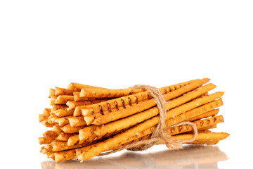 Straw is a bakery product. Several straws tied with jute thread isolated on a white background