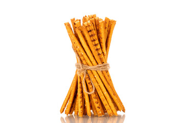 Straw is a bakery product. Several straws tied with jute thread isolated on a white background