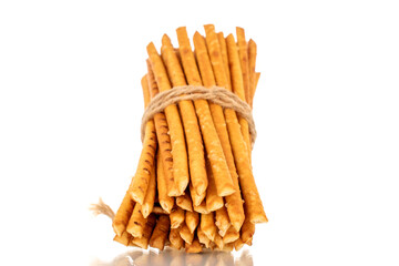 Straw is a bakery product. Several straws tied with jute thread isolated on a white background