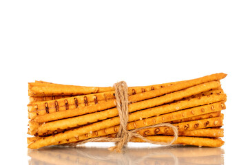 Straw is a bakery product. Several straws tied with jute thread isolated on a white background