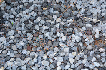 Gray gravel scattered on the ground.