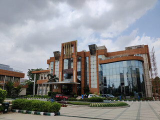 Image of buildings shot against grey clouds on a rainy day.
