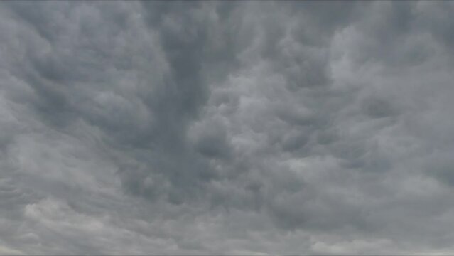 Sky background - time lapse with blue sky and moving clouds. Sky with the change of clouds moving and the direction of the wind in the sky changing.