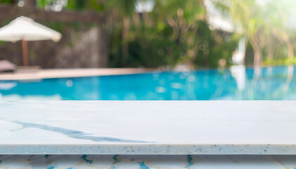 Empty tabletop and blurred swimming pool in a tropical resort in summer for display or montage your products.