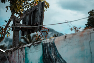 basketball net against mountains and grafitti