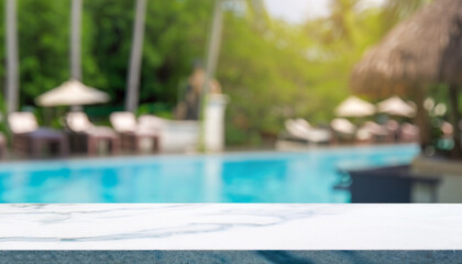 Empty tabletop and blurred swimming pool in a tropical resort in summer for display or montage your products.