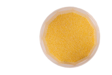 corn grits in plastic jars isolate, top view with reflection