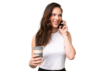 Young caucasian woman isolated over isolated background holding coffee to take away and a mobile