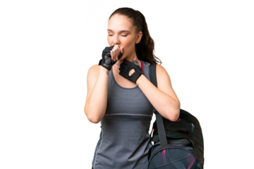 Young sport woman with sport bag over isolated background is suffering with cough and feeling bad