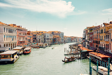 breathtaking beauty of Venice, Italy with an amazing view of the city. Delight in the enchanting sight of numerous gondolas gracefully sailing down one of the picturesque canals.