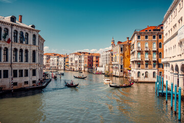 Breathtaking beauty of Venice, Italy with an amazing view of the city. Delight in the enchanting sight of numerous gondolas gracefully sailing down one of the picturesque canals