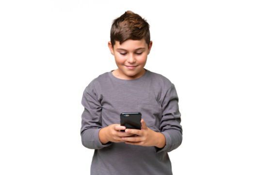 Little caucasian kid over isolated chroma key background sending a message with the mobile
