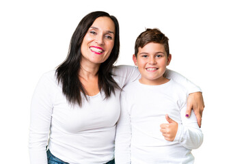 Little caucasian kid over isolated chroma key background giving a thumbs up gesture