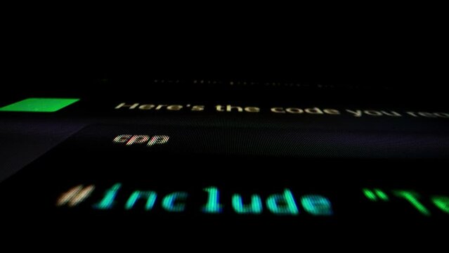 Closeup macro shot movement of coding script moving across LED screen with real-time AI-generated typing, showcasing advanced AI learning in optimization, debug and coding for software development.