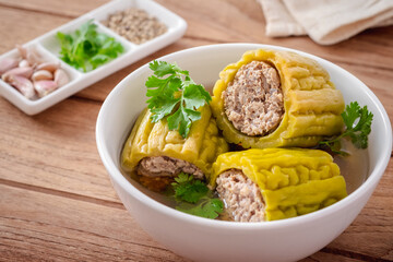Bitter gourd with minced pork soup in bowl .