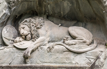 Nice close-up view of Lucerne's famous lion monument carved in stone. It is a landmark, a...