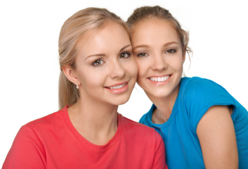 Mother and daughter embracing and smiling at camera