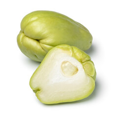 Whole and halved fresh chayote isolated on white background