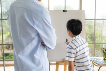 Fototapeta premium Family of artists that spend weekends at home painting with water