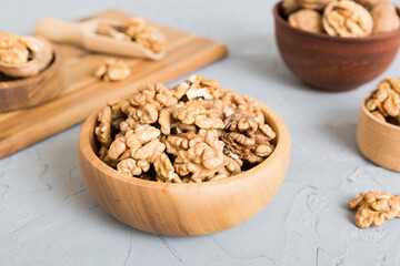 Fresh healthy walnuts in bowl on colored table background. Top view Healthy eating bertholletia concept. Super foods