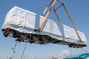 Unloading operation of project  cargo with port heavy lift cranes A crane on a large cargo ship...