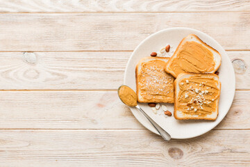 Peanut butter sandwiches or toasts on light table background.Breakfast. Vegetarian food. American cuisine top view vith copy space