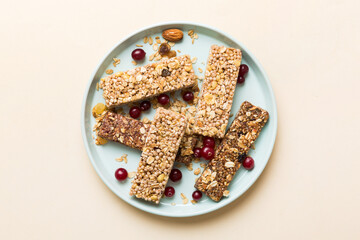 Various granola bars on table background. Cereal granola bars. Superfood breakfast bars with oats,...