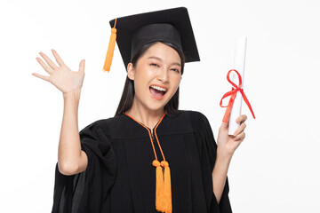 Beautiful Attractive Asian woman graduated in cap and gown smile with certificated in her hand...