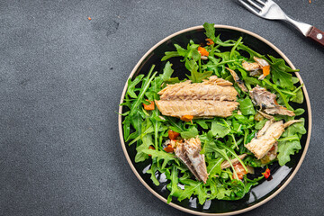 sardine salad green leaves salad mix healthy meal food snack on the table copy space food background rustic top view keto or paleo diet vegetarian pescatarian diet