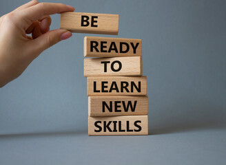 Learn new skills symbol. Concept words Be ready to Learn new skills on wooden blocks. Beautiful...