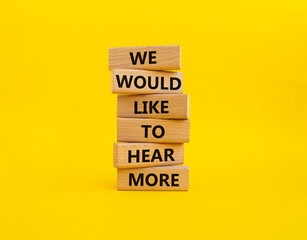 We would like to hear more symbol. Wooden blocks with words We would like to hear more. Beautiful yellow background. Business and We would like to hear more. Copy space.
