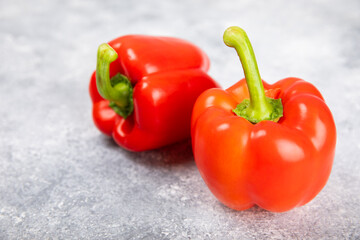 Fresh colorful red bell pepper on marble background. Bell pepper. Vegetables. Vegan food. Healthy foods. Place for text. Place to copy. Diet concept.