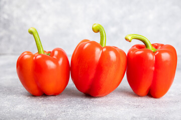 Fresh colorful red bell pepper on marble background. Bell pepper. Vegetables. Vegan food. Healthy foods. Place for text. Place to copy. Diet concept.