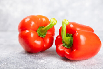 Fresh colorful red bell pepper on marble background. Bell pepper. Vegetables. Vegan food. Healthy foods. Place for text. Place to copy. Diet concept.