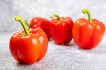 Fresh colorful red bell pepper on marble background. Bell pepper. Vegetables. Vegan food. Healthy foods. Place for text. Place to copy. Diet concept.