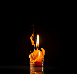 Fototapeta premium Burning candle on dark background with copy space. AI generated
