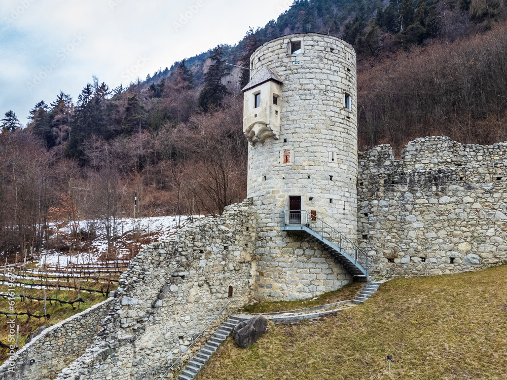 Wall mural novacella abbey from above. winter landscape