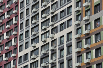 Modern residential high-rise building with baskets for air conditioners in Moscow, Russia