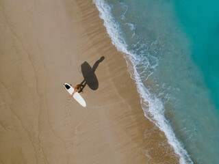 Aerial view of surfer at the beach - 616204501