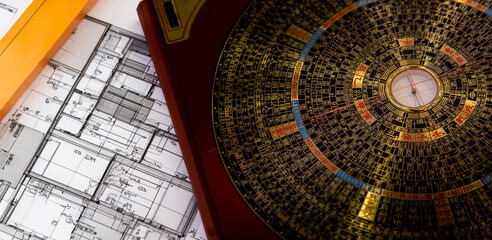 Antique chinese feng shui compass on home desing on background © Yanukit